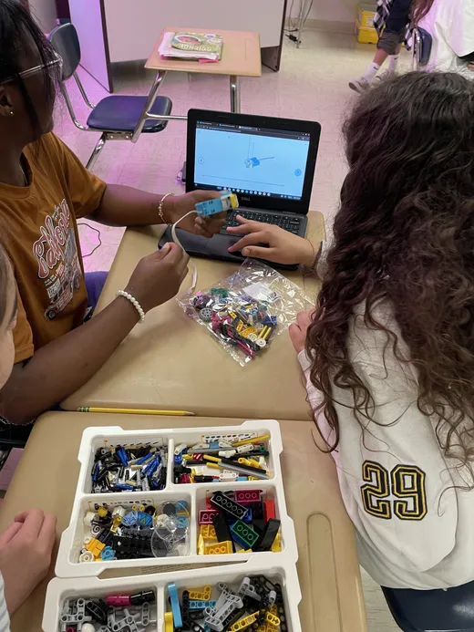 Students building a motorised robotics model during a STEM lesson