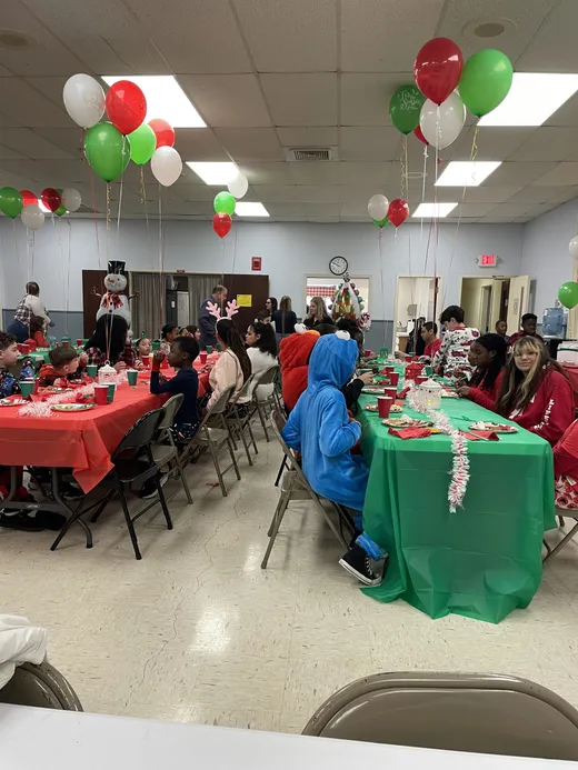 Families seated together at the Christmas pancake breakfast