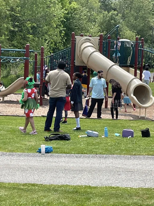 Students and teachers out on the playground at recess
